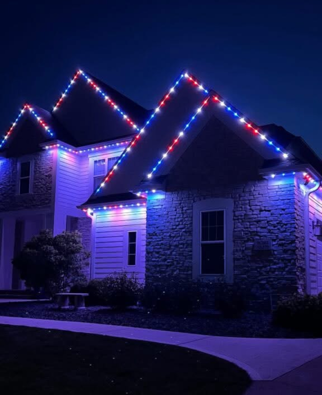Red white and blue patriotic LED lighting on stone home